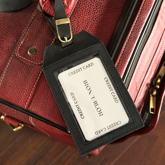 Black Leather Luggage Tag Attached to Travel Bag | Iron Tailor