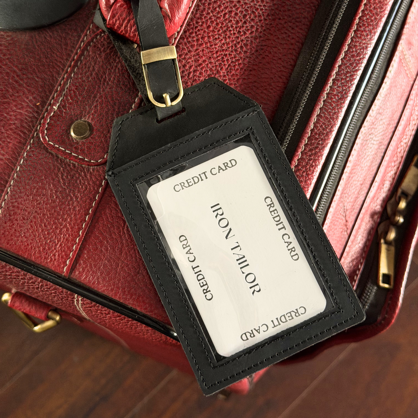 Black Leather Luggage Tag Attached to Travel Bag | Iron Tailor