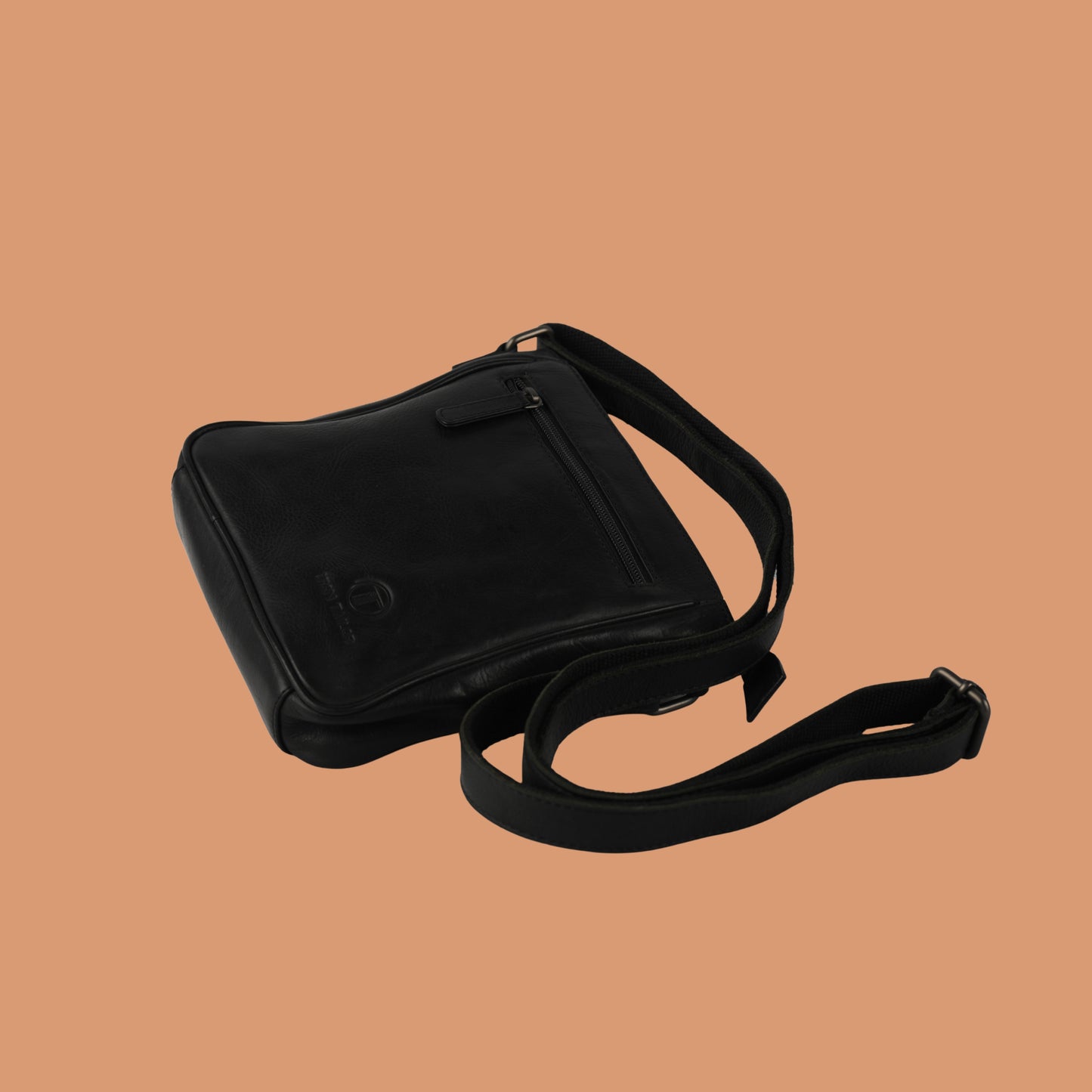 Angled View of Black Leather Sling Bag with Adjustable Strap | Iron Tailor
