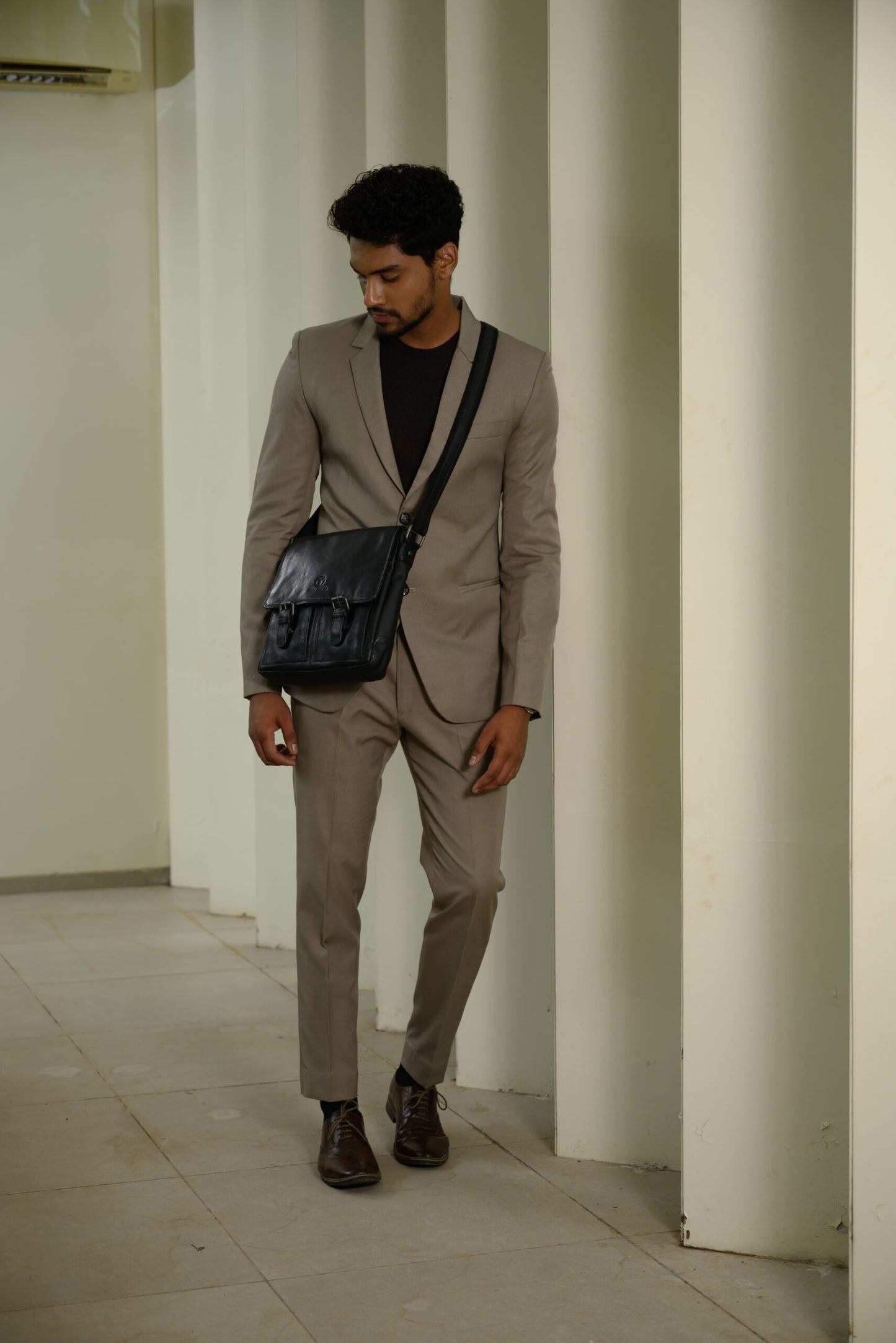 Man Wearing Black Genuine Leather Sling Bag | Iron Tailor