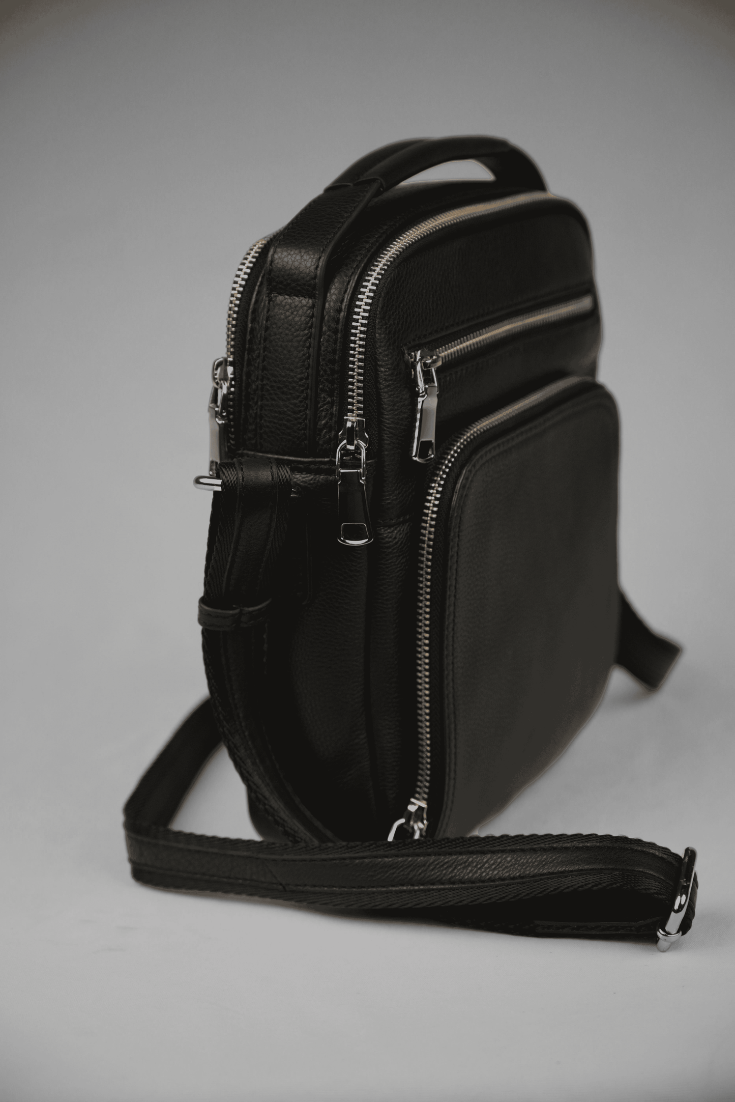 Black Leather Multizip Sling Bag Angled View | Iron Tailor