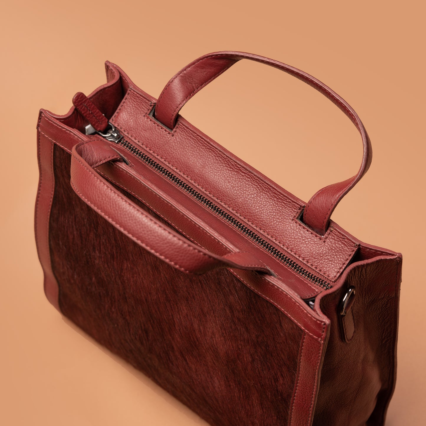Side View of Red Leather Clutch Handbag with Top Handle | Iron Tailor