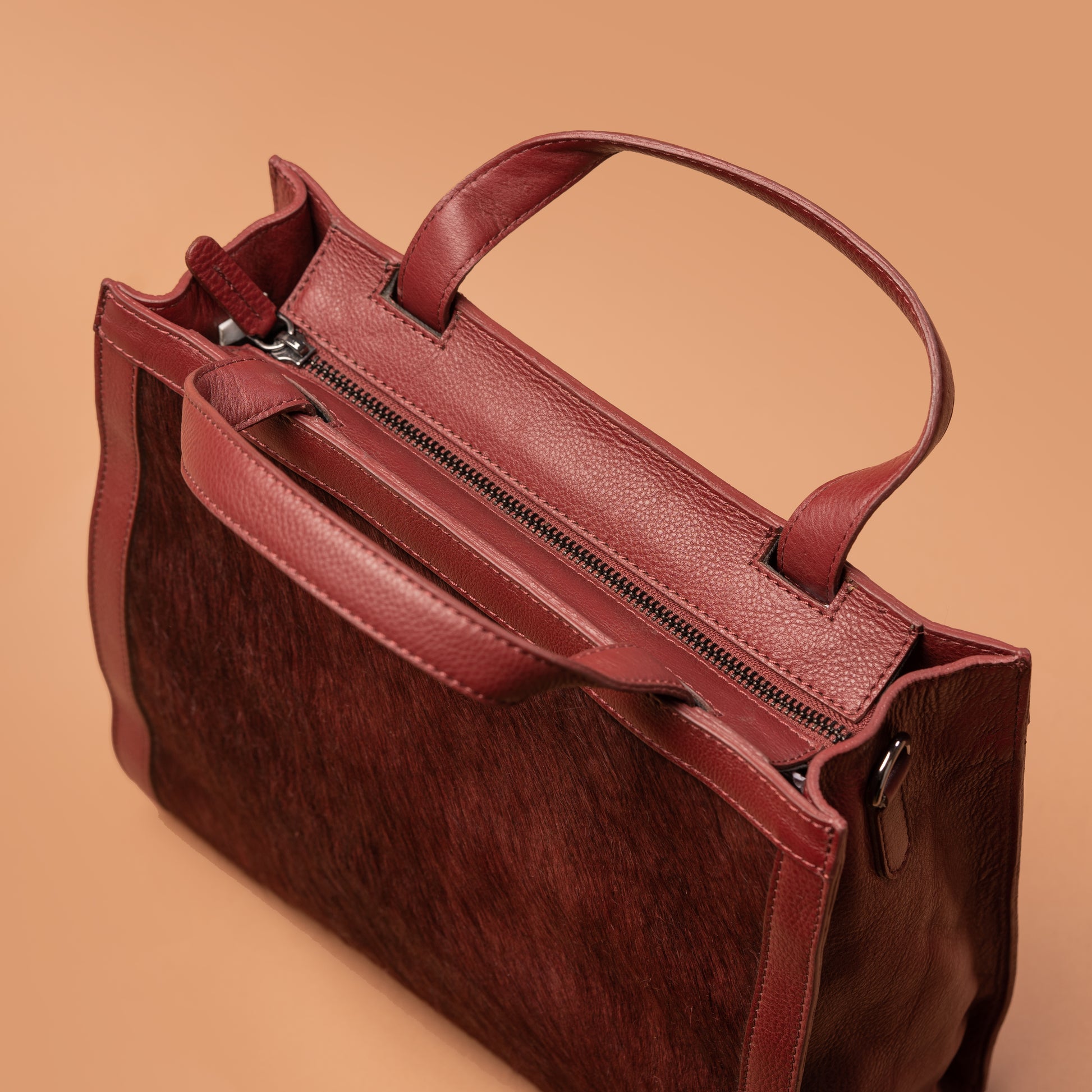 Side View of Red Leather Clutch Handbag with Top Handle | Iron Tailor