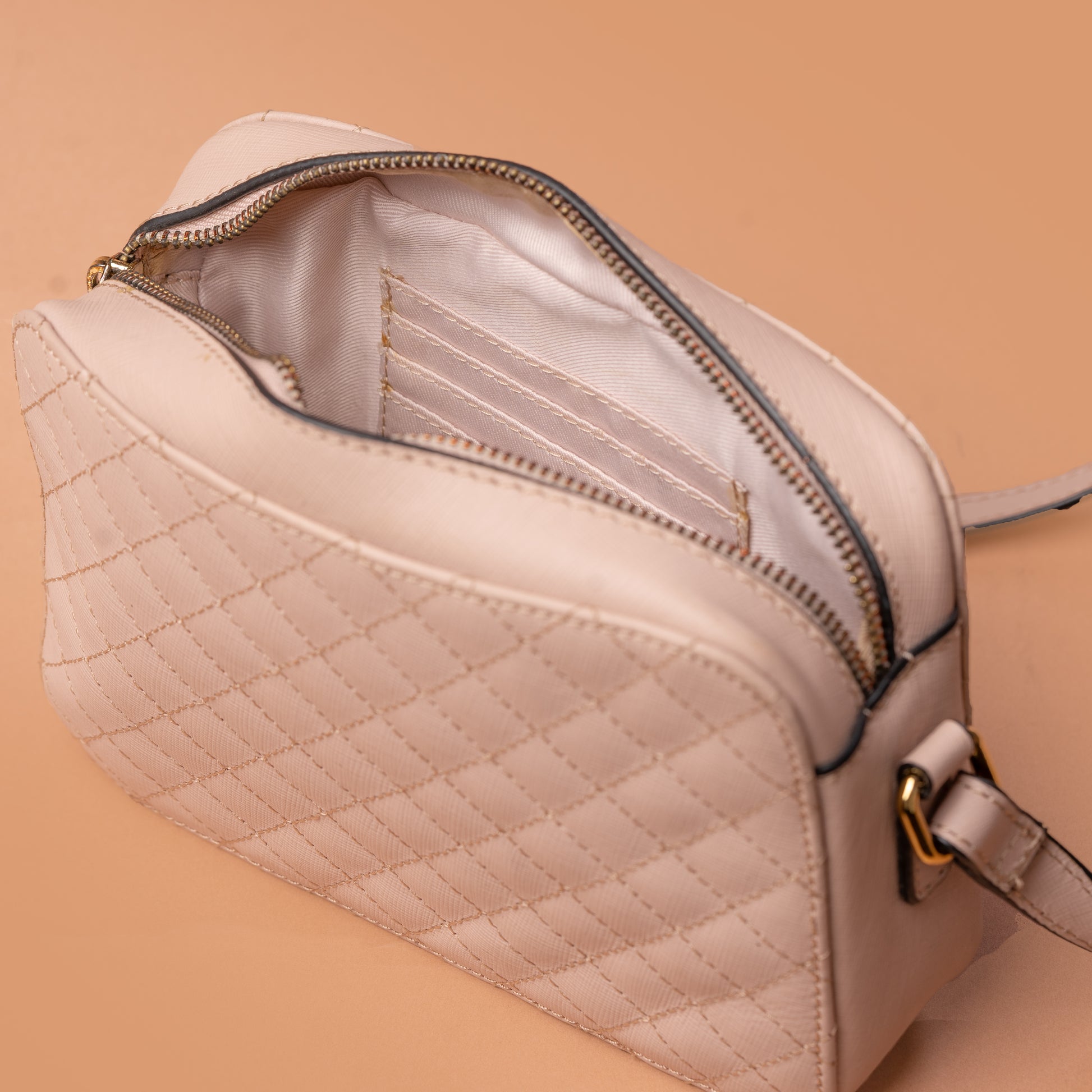 Rose Gold Diamond Stitch Leather Sling Bag with Spacious Interior | Iron Tailor